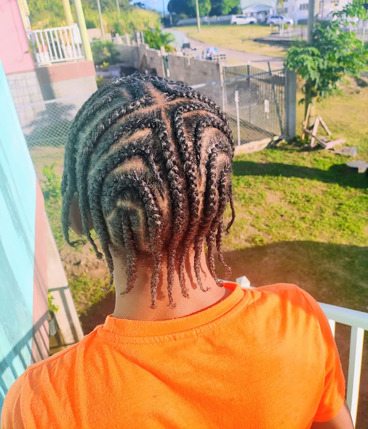 Men’s natural freestyle braids in St Kitts with clean parts and neat finish